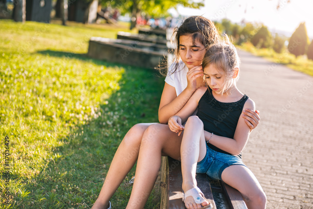 Girl comforting her sad friend Stock Photo | Adobe Stock