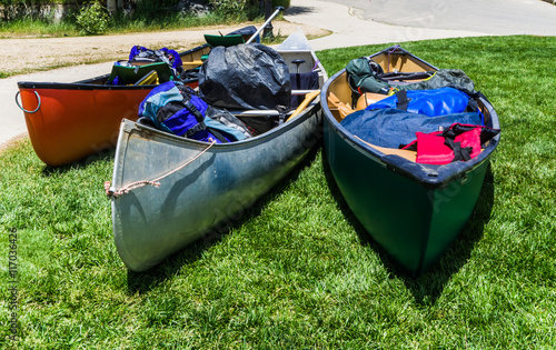 ready for n adventure: three canoes  filled with  gear Fototapet