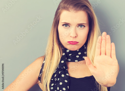 Billede på lærred Young woman making a rejection pose