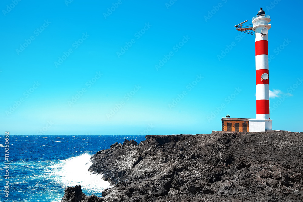 beautiful view of colorful Lighthouse on blue sky and ocean background