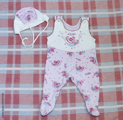 Set of newborn bodysuit and hat next.