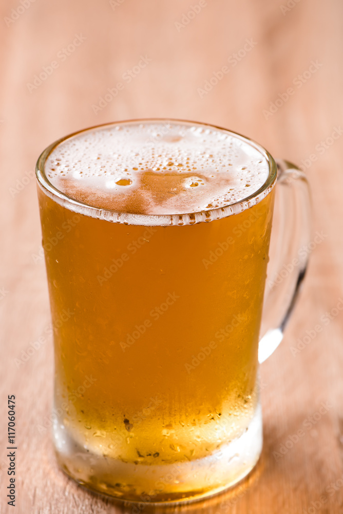 beer in mug glass on wood table beer in mug glass on wood table
