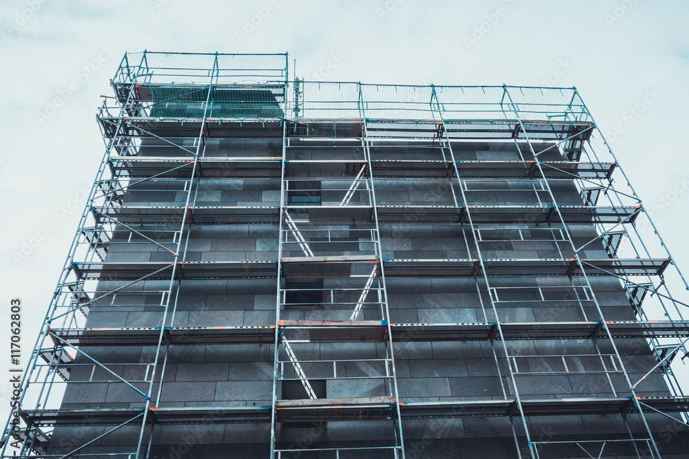 Apartment block surrounded by scaffolding