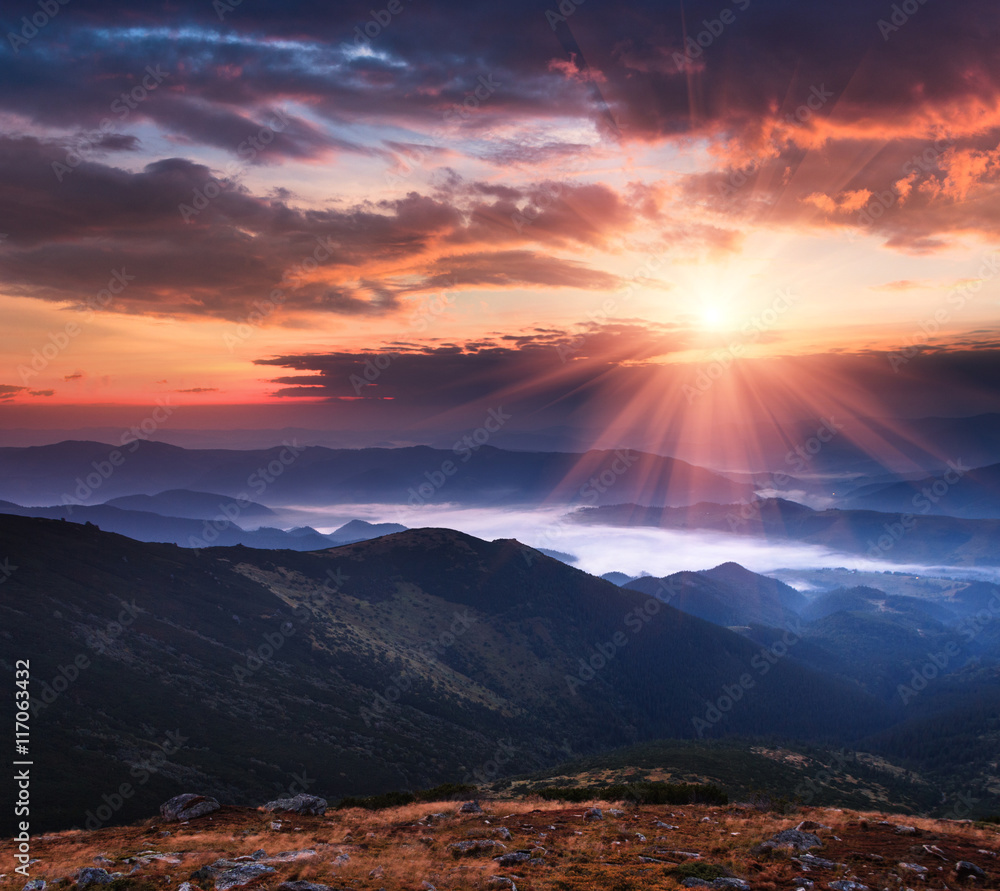 Colorful panoramic sunrise in the mountains landscape. Dramatic morning sky.