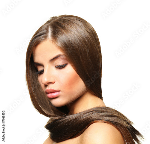 Young woman with healthy hair on white background