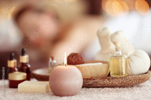 Spa composition and girl on blurred background
