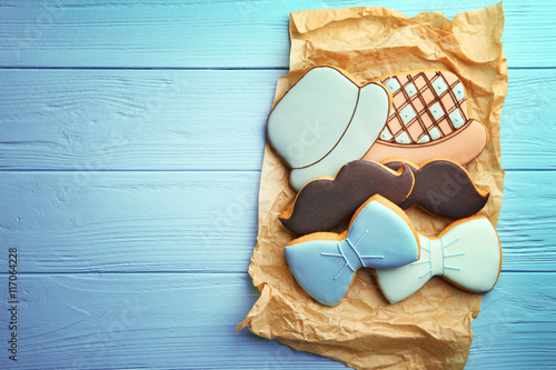 Tasty cookies on blue wooden background