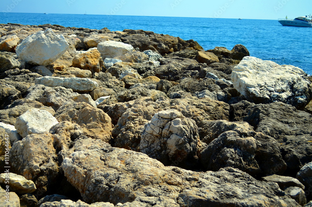 rocky coast at french riviera with blue water rocky coast at french riviera with blue water