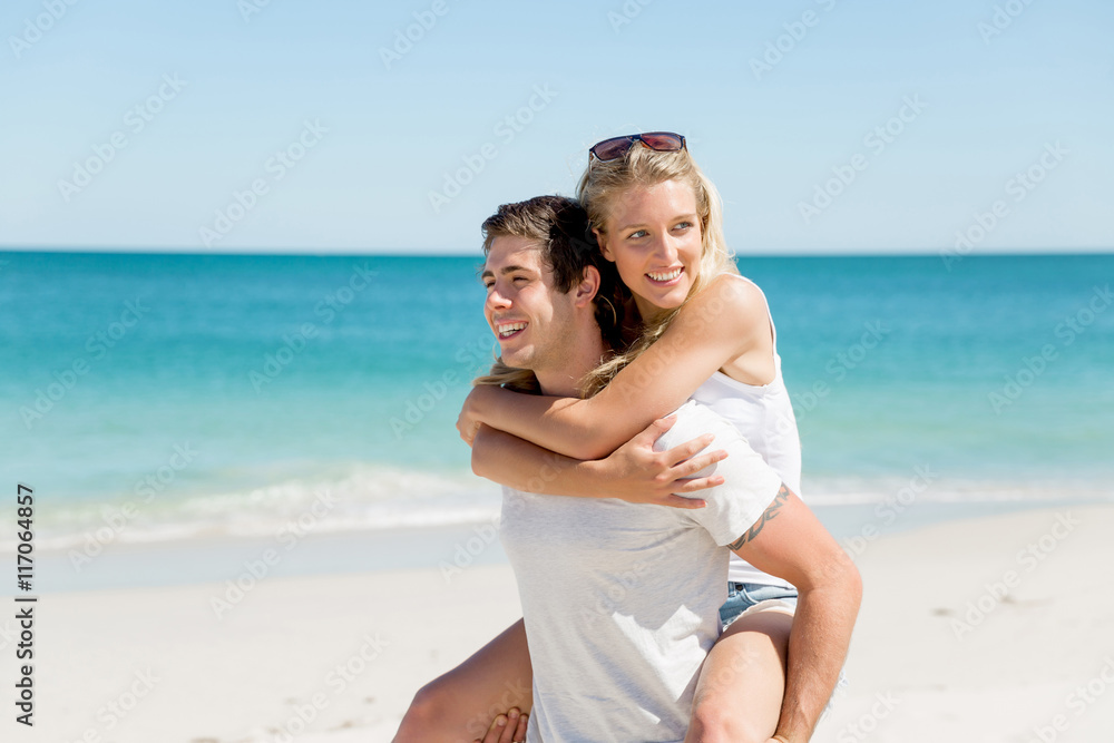 Portrait of man carrying girlfriend on his back Portrait of man carrying girlfriend on his back
