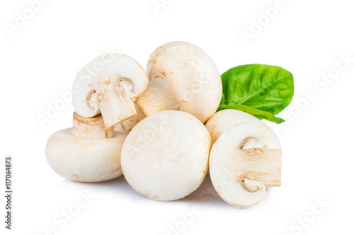 Mushrooms with basil leaves isolated on white background