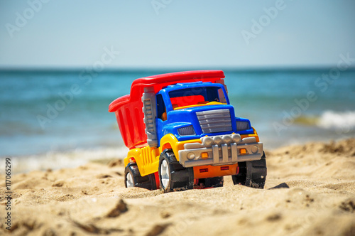 Toy in the sand beach.