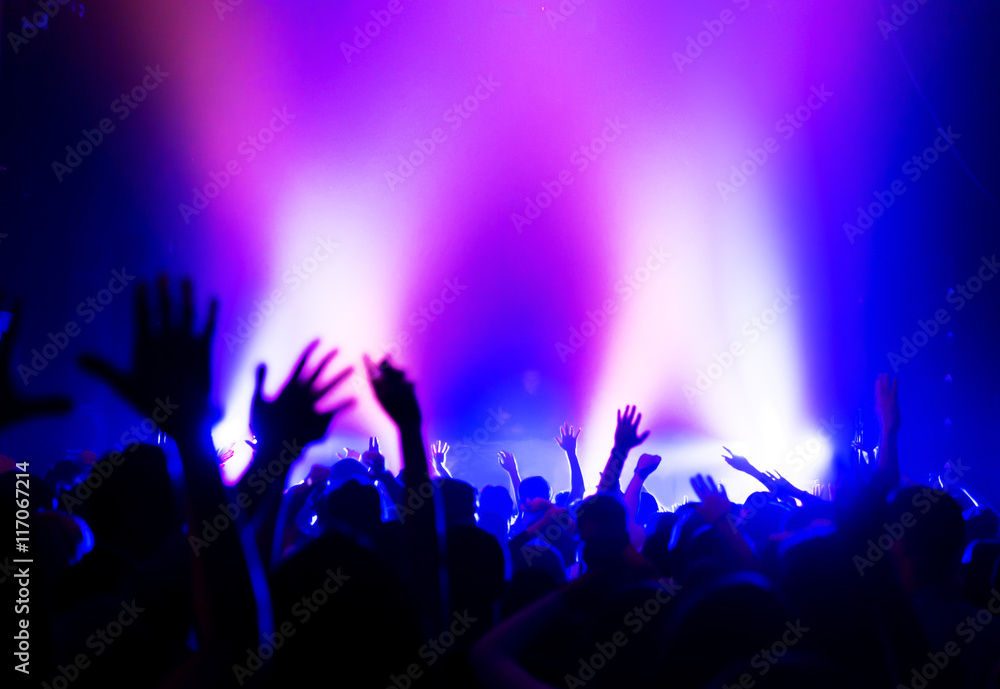 silhouettes of massive crowd at party concert club music happy