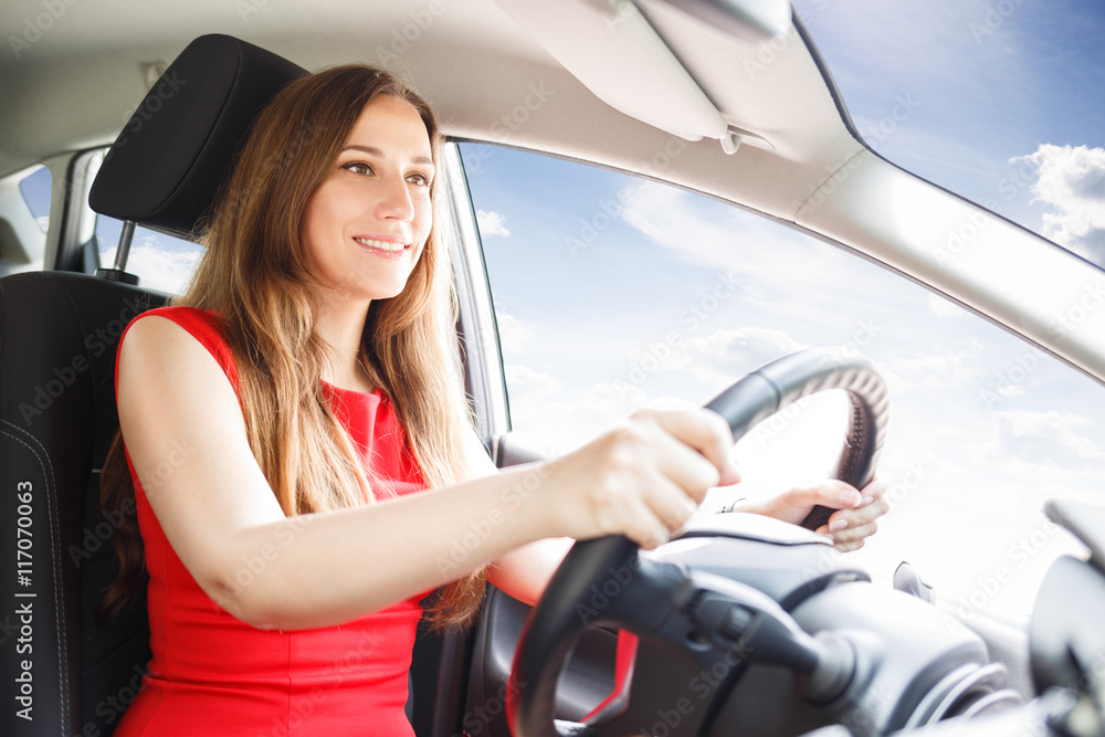 Young woman driving car. Fast delivery background
