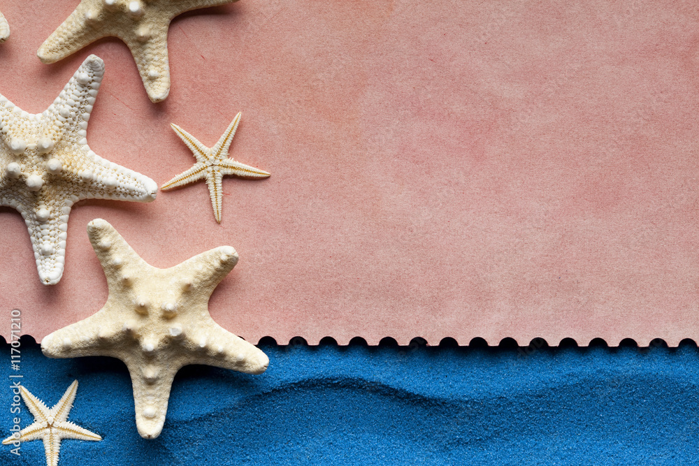 Paper sheet and starfish on blue background Paper sheet and starfish on blue background