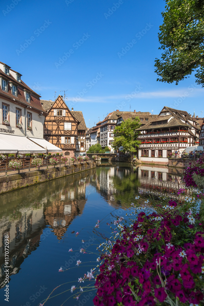 Strasbourg, France. The picturesque landscape with reflection in the water of old buildings in the old quarter 