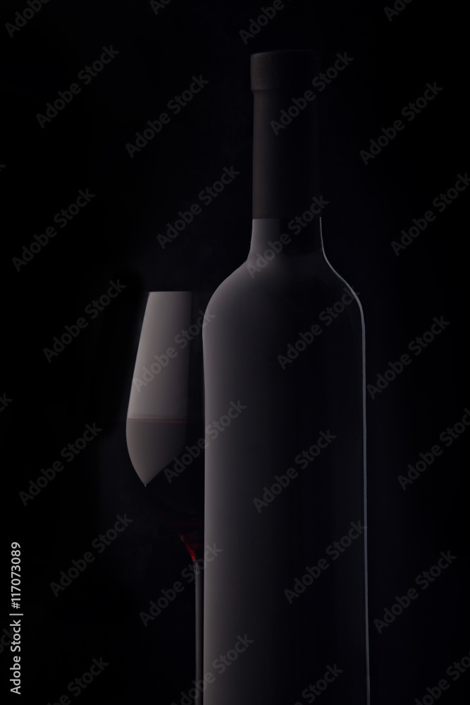 Bottle and a glass of red wine Bottle and a glass of red wine