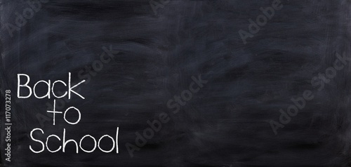 Back to school on a black chalkboard. 3d illustration