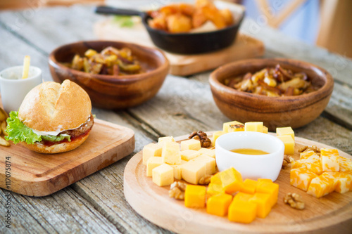 Cheese and nuts on a wooden background