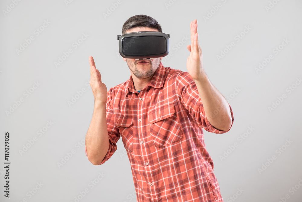 Man in fighter stand with virtual reality glasses Man in fighter stand with virtual reality glasses
