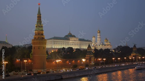 twilight view of embankment of Moscow river and Moscow Kremlin with ruby stars