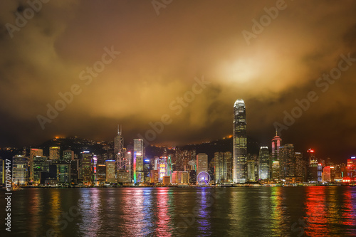 Hong Kong night view with reflections of light on the cloud at victoria harbor
