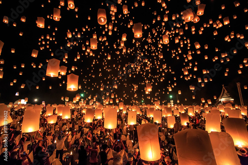 CHIANG MAI, THAILAND - NOVEMBER 8, 2014:  Visitors are launching colorful lanterns in Loykratong festival at Chiangmai, Thailand.