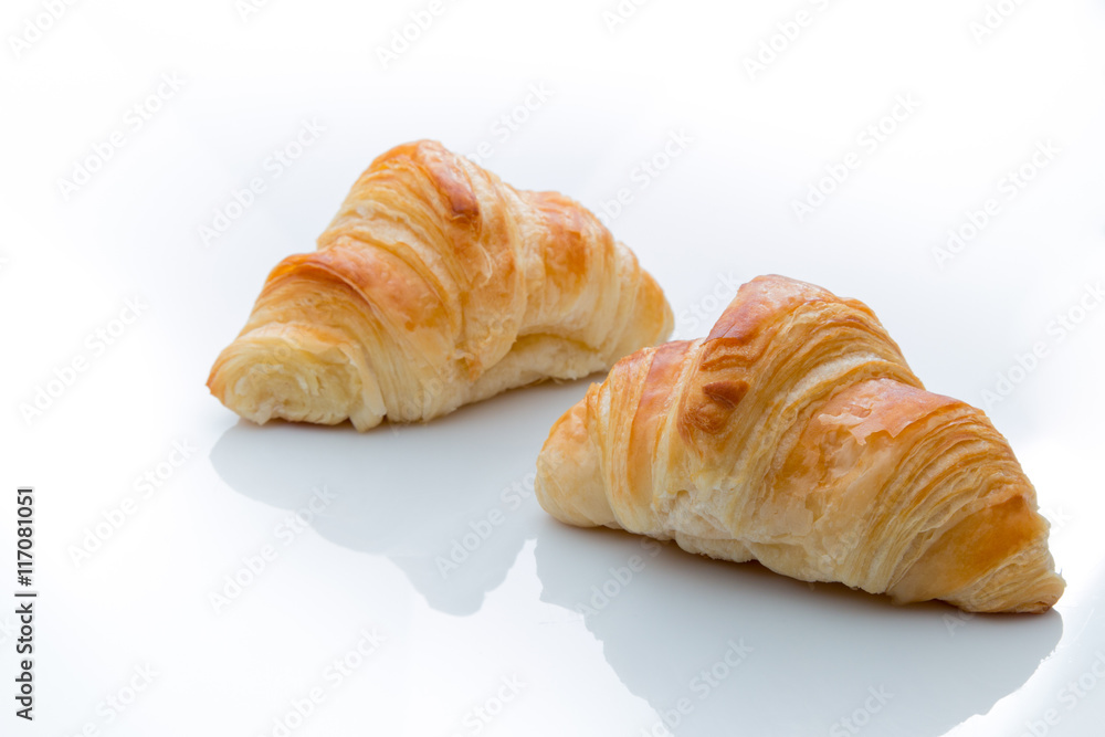Two croissants on a white background