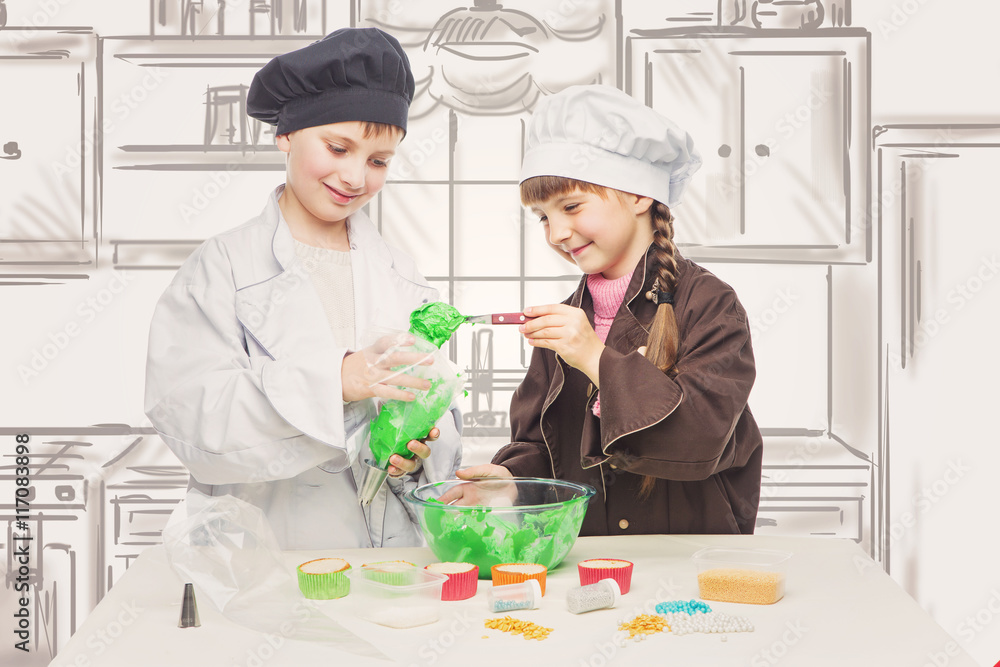 Children making christmas cupcakes Children making christmas cupcakes