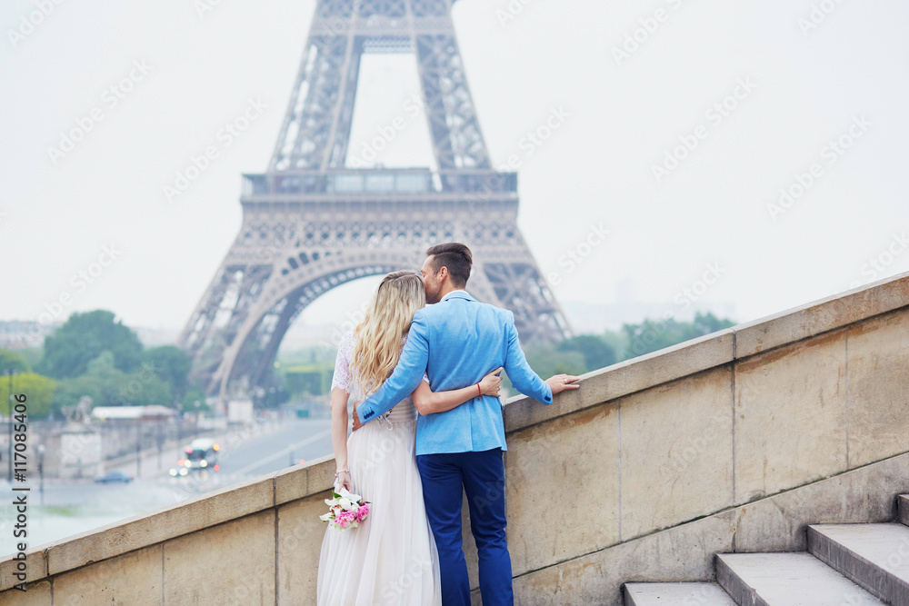 Just married couple near the Eiffel tower in Paris Just married couple near the Eiffel tower in Paris