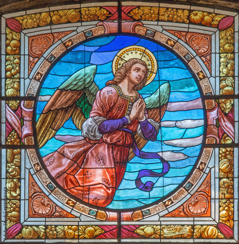 CREMONA, ITALY - MAY 24, 2016: The angel on the stained glass in church Chiesa di Santa Agata by Don Abate Agostino Desirelli from end of 19. cent.