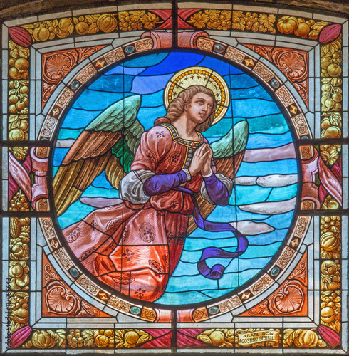 CREMONA, ITALY - MAY 24, 2016: The angel on the stained glass in church Chiesa di Santa Agata by Don Abate Agostino Desirelli from end of 19. cent.