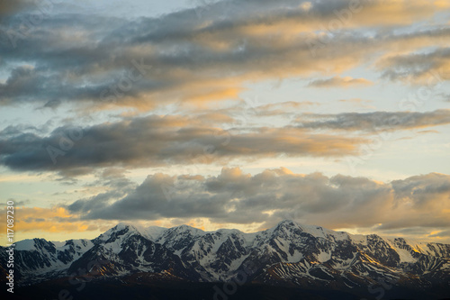 Kurai steppe and North Chuya ridge at the dawn. Clouds and Mountains © estas