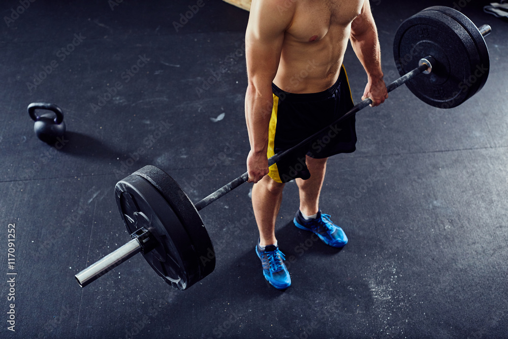Overhead picture of athlete doing deadlift exercise at the gym Overhead picture of athlete doing deadlift exercise at the gym