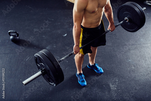 Overhead picture of athlete doing deadlift exercise at the gym