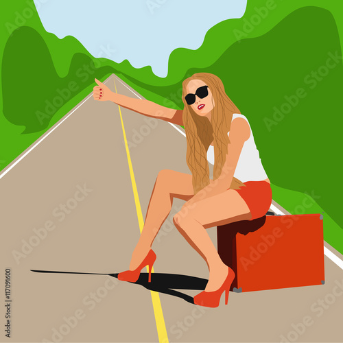 a young girl hitchhiking travels with a large suitcase. 