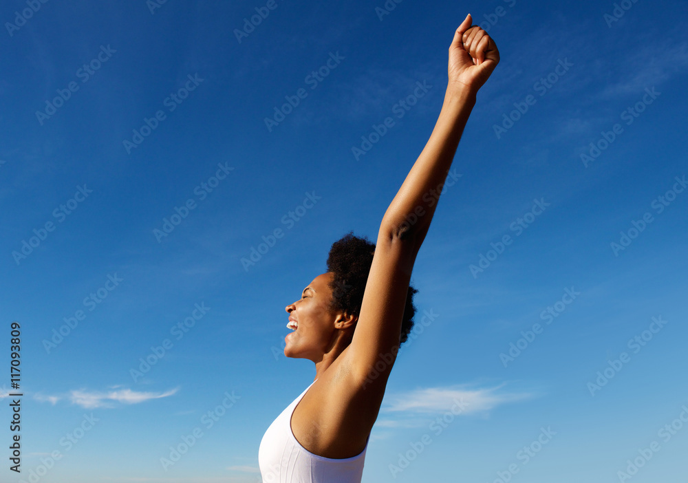 Excited fitness woman celebrating success outdoors Excited fitness woman celebrating success outdoors