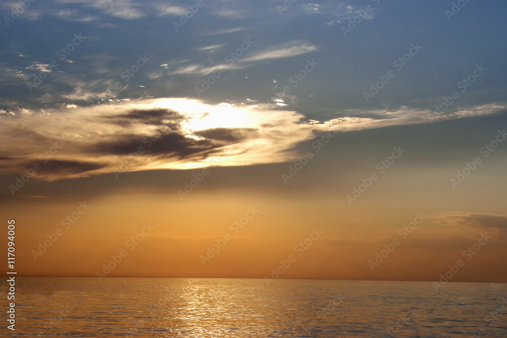 beautiful sunset with clouds over sea