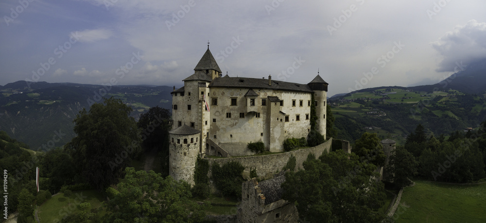 Castle Proesels in Italy. This is a 3 image aerial panoramic of the Castle, which is 20 minutes North of the city of Bolzano in the Italian Alps.