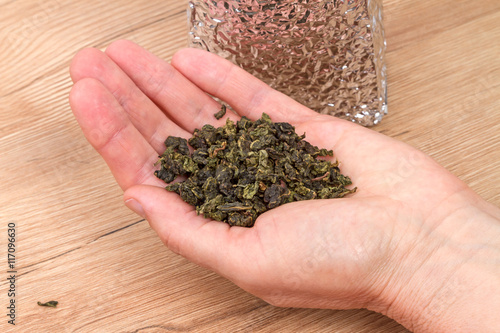 Dry herbal tea on a palm