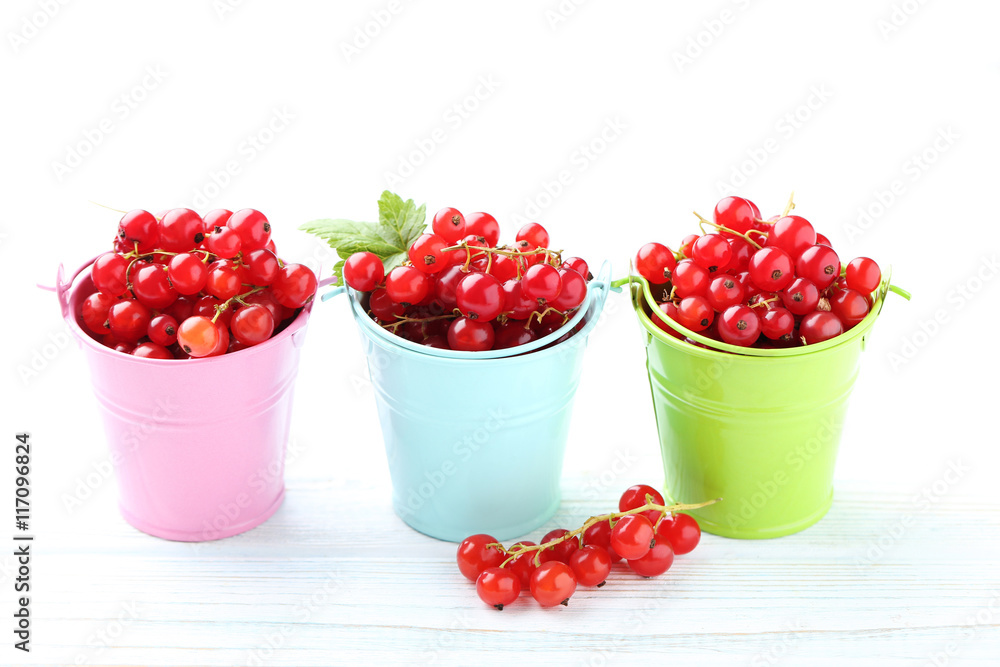 Red currant on a white wooden table Red currant on a white wooden table