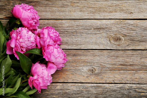 Bouquet of pink peony flowers on wooden table © 5second