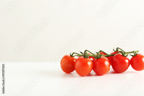 Cherry tomatoes branch isolated on a white background