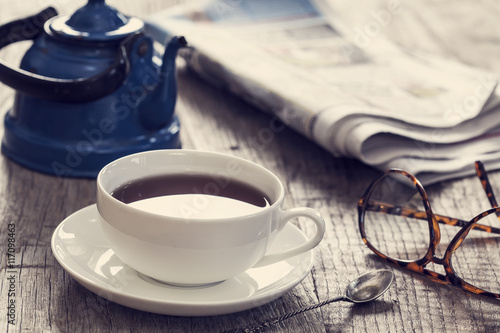 Newspaper with cup of tea