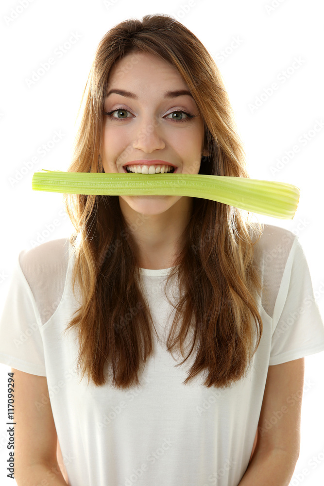 Beautiful girl eating celery, isolated on white Beautiful girl eating celery, isolated on white