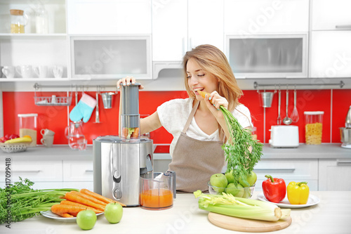 Beautiful girl making juice...