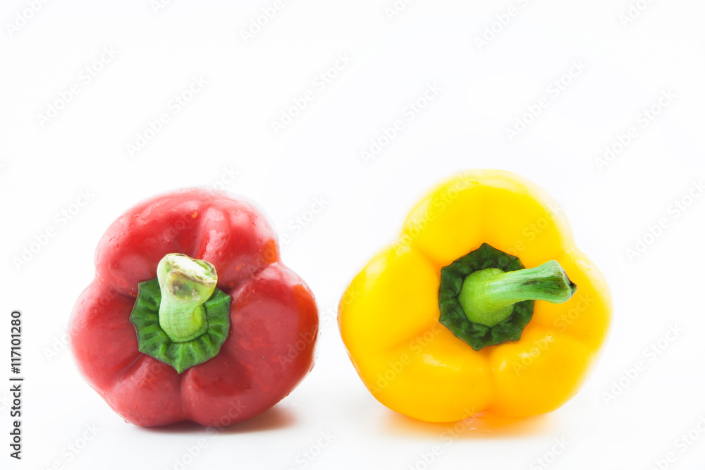 Yellow and red pepper on white background.Healthy concept. Yellow and red pepper on white background.Healthy concept.