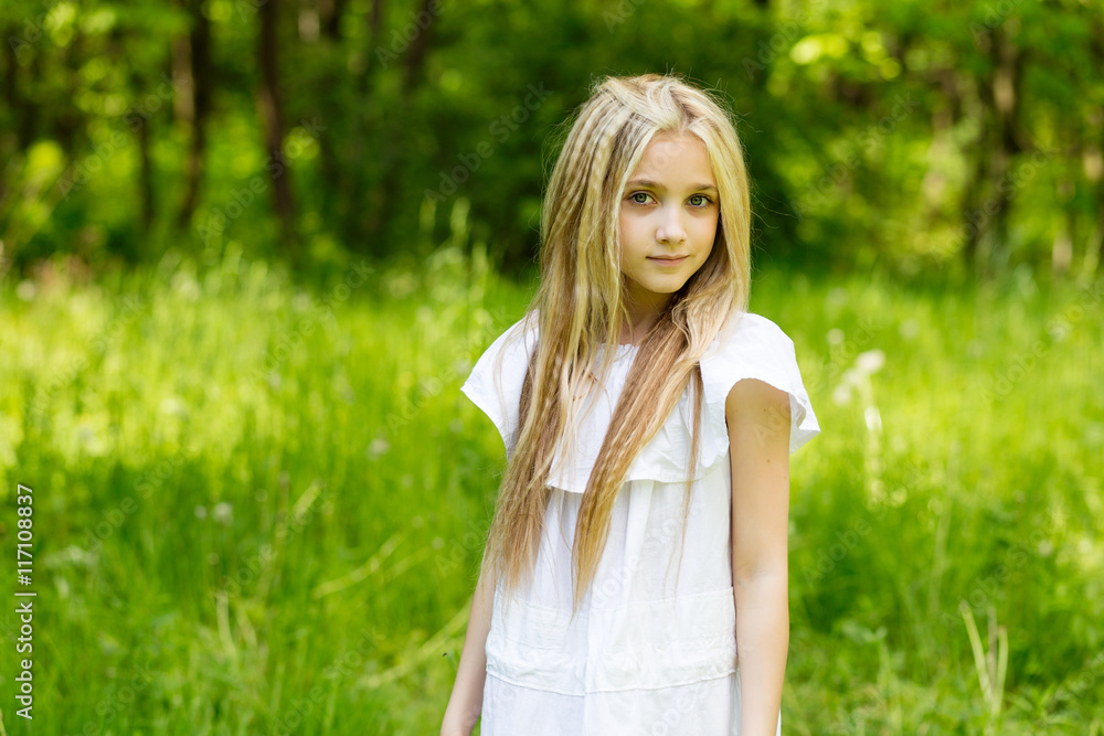 Portrait cute blonde girl outdoors in summer Portrait cute blonde girl outdoors in summer