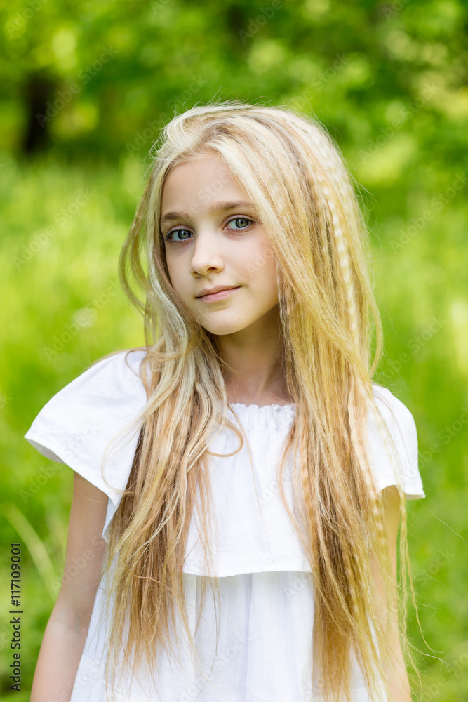Portrait cute blonde girl outdoors in summer Portrait cute blonde girl outdoors in summer