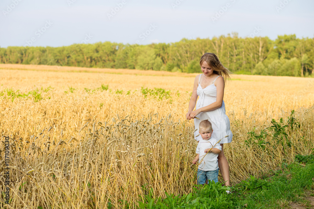 pregnant woman with a small boy