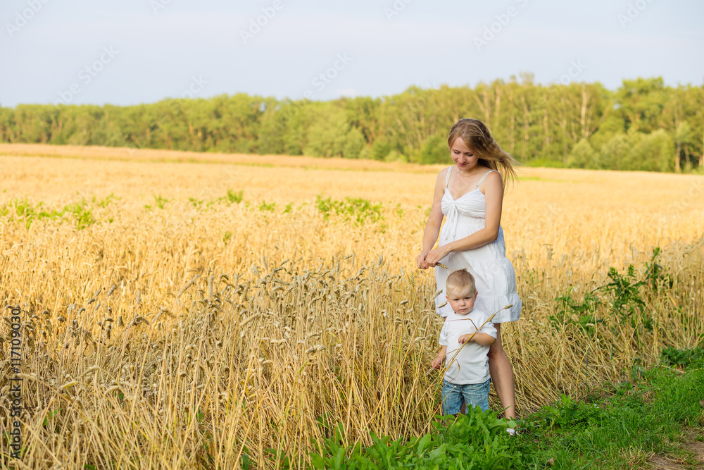 pregnant woman with a small boy pregnant woman with a small boy